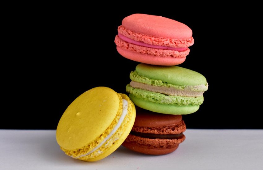 four coulourful macaroons in a pile