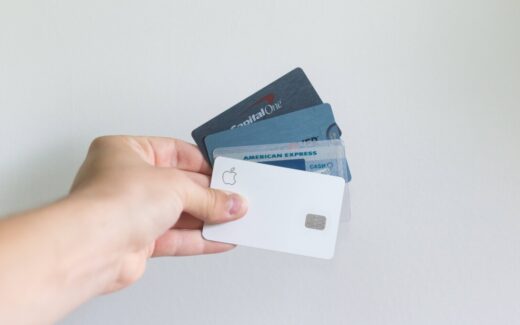 hand holding credit cards in a fan